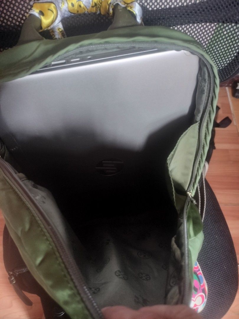 Tory Burch Olive Green Nylon Backpack with Smiley Scarf (Category: Backpacks) located in Cavite. Submitted by annasoriano1982 (Listing ID 1456991448, Image 3). Description: pls see handle my nag chops na pero hindi naman malala kaya my twilly sa front pocket my namumuti but not obvious as well kasya 13-14" inches laptop not guarantee kung sa patibayan lang mas matibay pa sya sa relasyon nyong mag jowa😁😁😁 ykk zip.