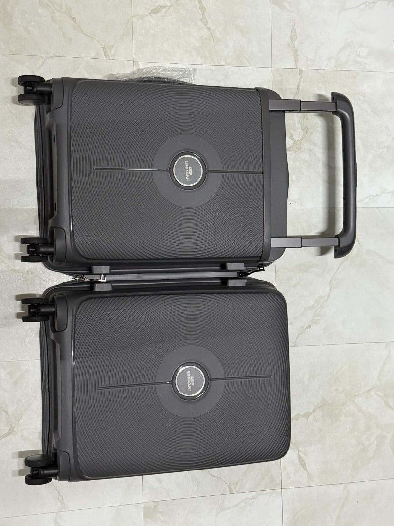 Urban Luggage (Category: Luggage) located in Taguig. Submitted by perfect_restyle (Listing ID 1457003980, Image 3). Description: - Brand: Urban Luggage - Size: 20" Cabin Size - Type: Hardcase - Color: Dark Gray - Features: Textured exterior for durability, organized interior with straps and zippered compartments, smooth-rolling wheels. - Ideal for: Weekend trips, business travel, carry-on. - Availability: Rapid Sell item. - Meetup locations: Glor