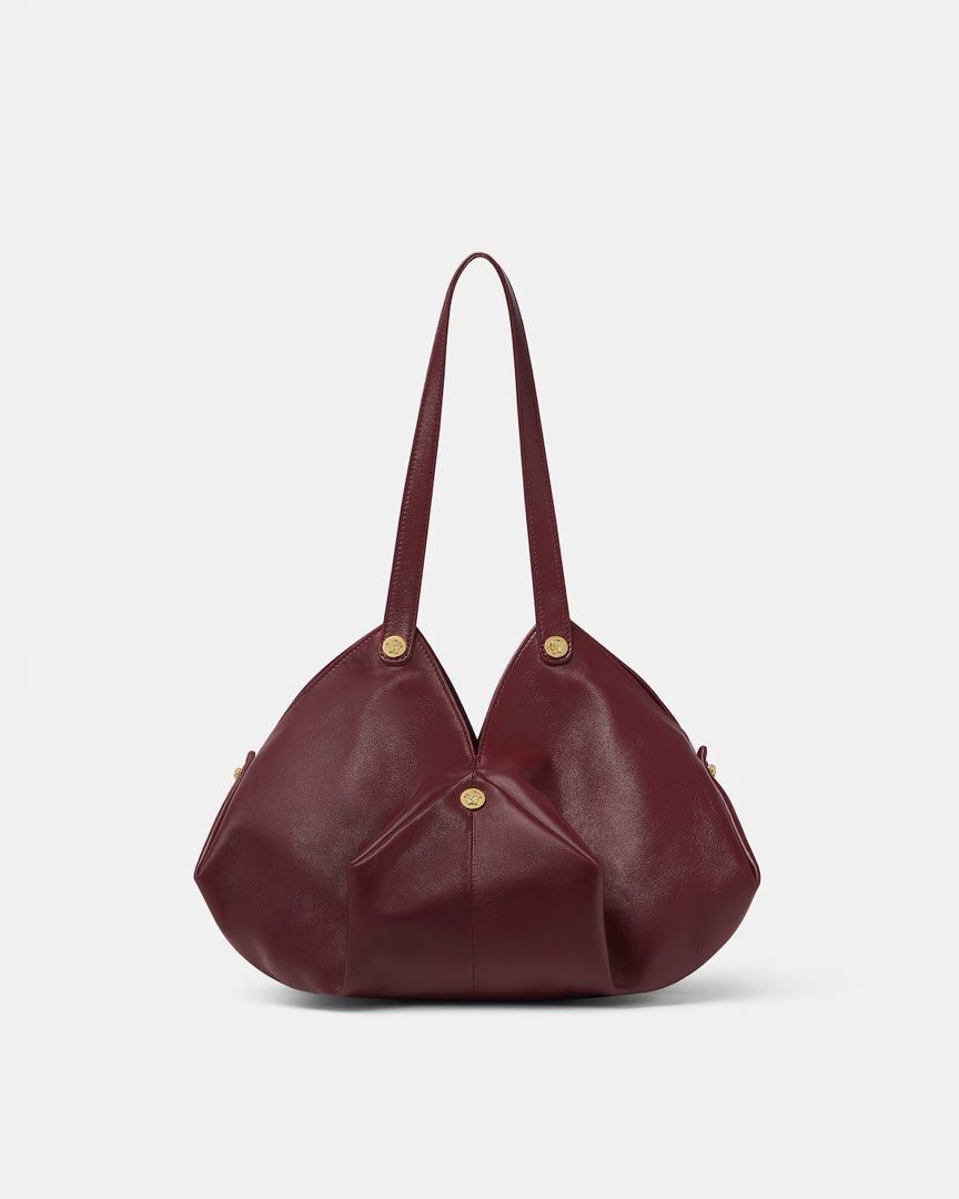 Versace Protea Bag (Category: Luxury Bags & Wallets) located in Las Pinas. Submitted by shopdeynuh (Listing ID 1456998728, Image 1). Description: Brand new, never worn. Perfect for gifting. Comes with dustbag, paperbag and cards. .