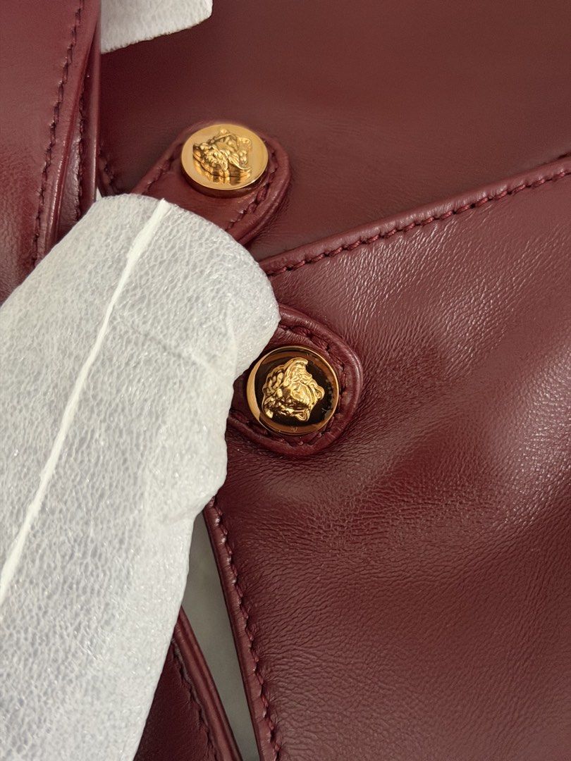 Versace Protea Bag (Category: Luxury Bags & Wallets) located in Las Pinas. Submitted by shopdeynuh (Listing ID 1456998728, Image 3). Description: Brand new, never worn. Perfect for gifting. Comes with dustbag, paperbag and cards. .