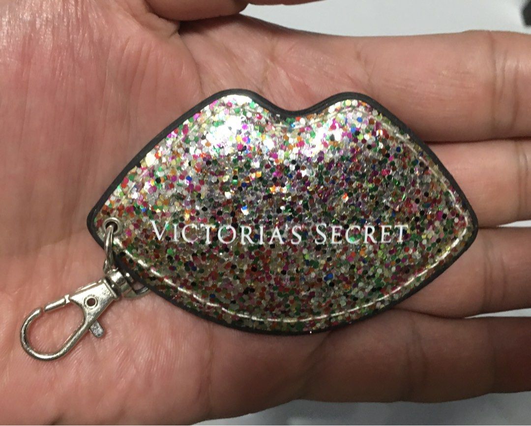Victoria's Secret Glitter Lips Keychain Charm (Category: Other Accessories) located in Pasay City. Submitted by gilbertso62551 (Listing ID 1457057442, Image 2). Description: - Cute Victoria's Secret keychain - Shaped like lips with glitter - Features Victoria's Secret logo on both sides - Comes with a silver clip - Ideal for decorating bags or keys - Adds a touch of sparkle - As is,where is - Not BrandNew .