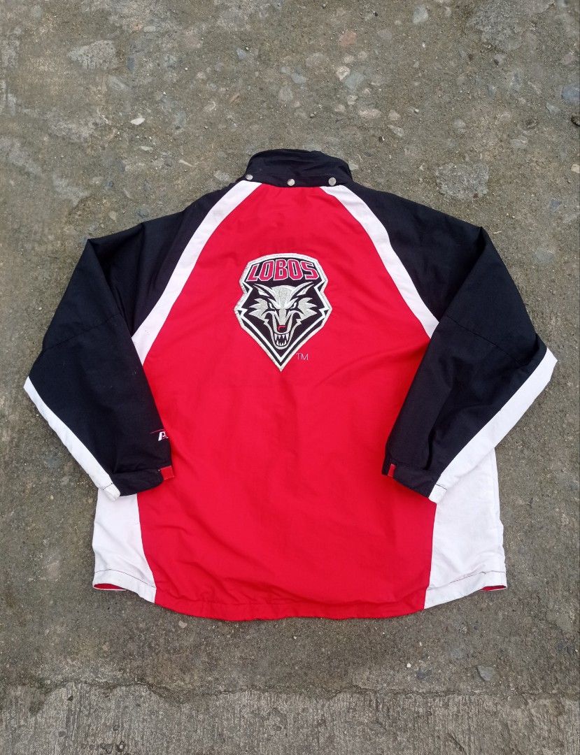 vintage New Mexico Lobos pro player windbreaker jacket (Category: Coats, Jackets and Outerwear) located in Guiguinto. Submitted by selected_3rp (Listing ID 1457084543, Image 2). Description: vintage New Mexico Lobos pro player windbreaker jacket red, black, and white colorblock design and a large wolf logo patch on the back. size XL issue missing hood excellent condition pm.