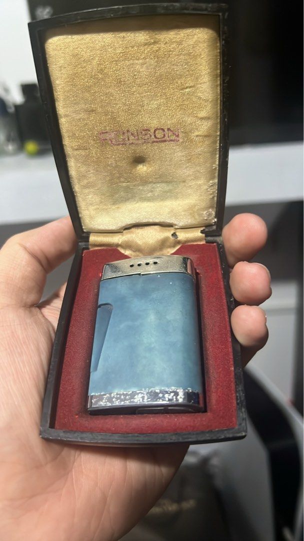 Vintage Ronson Blue Comet Butane Lighter (Category: Vintage Collectibles) located in Las Pinas. Submitted by pete210 (Listing ID 1457091595, Image 1). Description: - Vintage Ronson lighter from the 1960s - Original presentation box included - Light blue finish with decorative silver band - Box features gold-colored satin lining with embossed Ronson logo - Ideal collectible item Price is negotiable!.