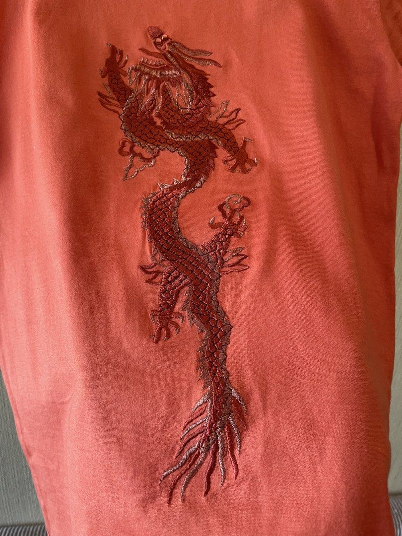 Vivienne Tam Embroid Dragon T-shirt (Category: Shirts) located in Agoo. Submitted by omaethrift (Listing ID 1456975277, Image 2). Description: - Vivienne Tam t-shirt blouse - Size 0 - 100% Cotton - Embroidered dragon design - Short sleeves - Easy care (refer to tag) - A unique and stylish wardrobe essential!.