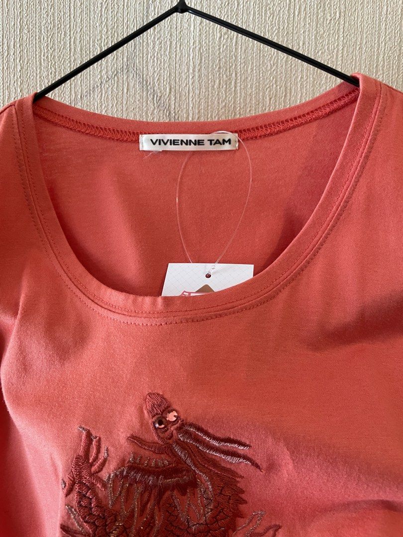 Vivienne Tam Embroid Dragon T-shirt (Category: Shirts) located in Agoo. Submitted by omaethrift (Listing ID 1456975277, Image 3). Description: - Vivienne Tam t-shirt blouse - Size 0 - 100% Cotton - Embroidered dragon design - Short sleeves - Easy care (refer to tag) - A unique and stylish wardrobe essential!.