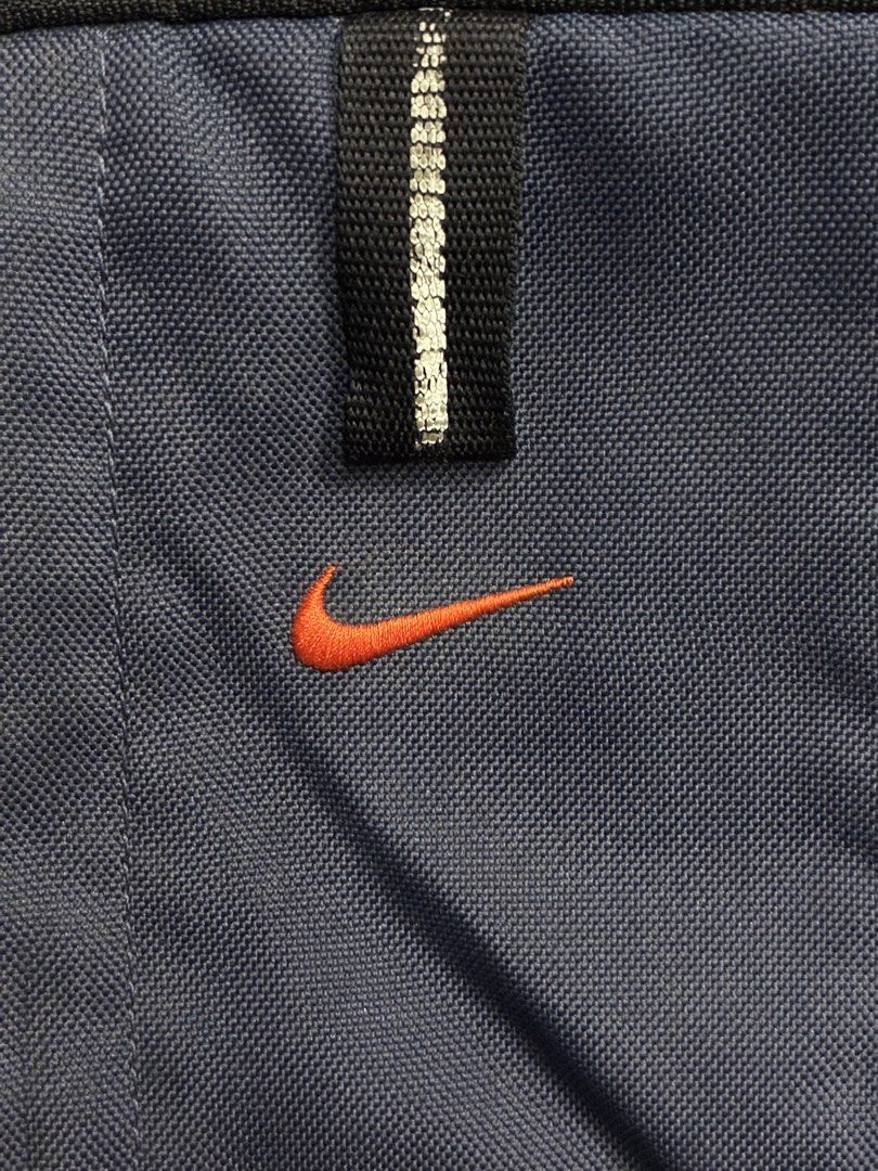 VNTG NIKE Y2K BACKPACK (Category: Backpacks) located in Manila. Submitted by garahe_secretshop (Listing ID 1457122832, Image 2). Description: - Vintage Nike backpack - Y2K era style - Color: Navy blue and grey - Features side mesh pockets - Waterproof - Missing pullers -Expired reflectorized .