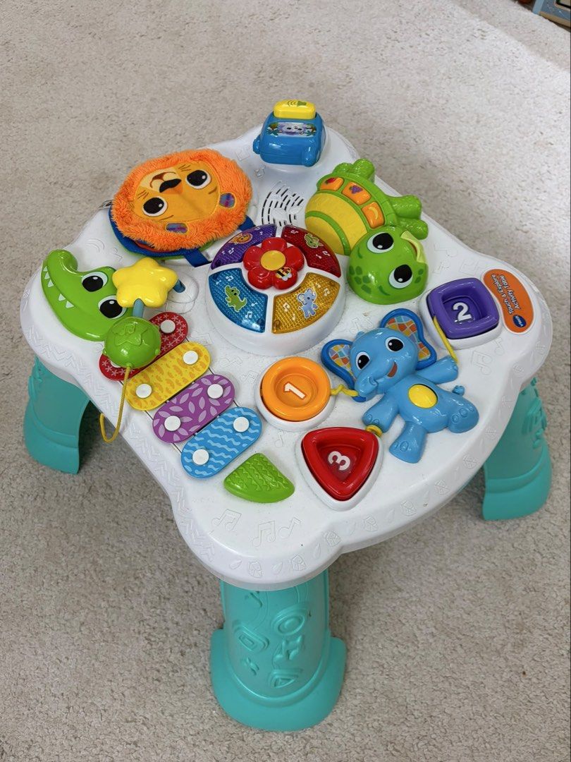 VTech Touch & Explore Activity Table (Category: Infant Playtime) located in Kuala Lumpur. Submitted by girlsellswhat (Listing ID 1457115417, Image 2). Description: Selling cheap! Bought at RM150. No box. - Fun VTech activity table for little ones. - Interactive elements: phone, shape sorter, fabric page. - Teaches fruits, colors, and numbers. - Promotes playtime and development. - Detachable legs for versatile floor play..