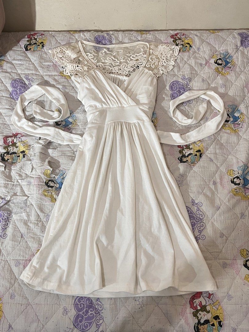 White Lace Cap Sleeve Wrap Dress (Category: Dresses) located in Davao. Submitted by sonateine (Listing ID 1457058866, Image 2). Description: - Cute white dress with elegant lace detailing. - Flattering wrap front design. - Gathered waist for a defined silhouette. - Delicate lace cap sleeves. - Flowy, knee-length skirt. - Adjustable tie at the back. - Versatile for casual outings or special events..