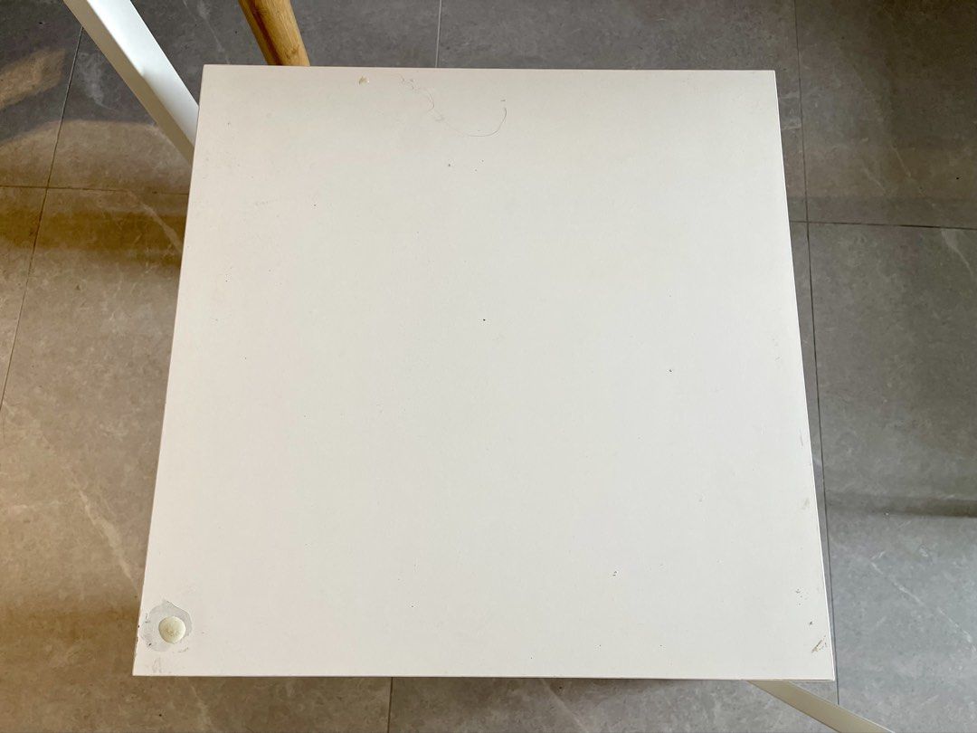 White Square Side Table (Category: Tables & Sets) located in Singapore. Submitted by cosmic.tammy.koh (Listing ID 1456986549, Image 2). Description: - White square table - Simple, space-saving design - Sturdy legs - Easy to clean surface - Minor cosmetic marks on top - size: length 55 cm x width 55 cm x height 45.5cm - FOC item - self collection only .