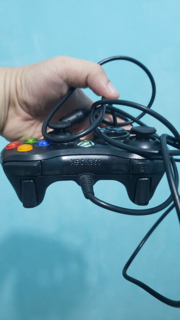 Wired Xbox 360 Controller (Category: Controllers) located in Daet. Submitted by leumas08 (Listing ID 1457010316, Image 1). Description: - Original wired controller for Xbox 360 - Classic black finish - Fully functional and works well - Shows minor scuffs from normal use - Ready for your next gaming session!.