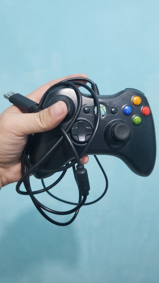 Wired Xbox 360 Controller (Category: Controllers) located in Daet. Submitted by leumas08 (Listing ID 1457010316, Image 2). Description: - Original wired controller for Xbox 360 - Classic black finish - Fully functional and works well - Shows minor scuffs from normal use - Ready for your next gaming session!.