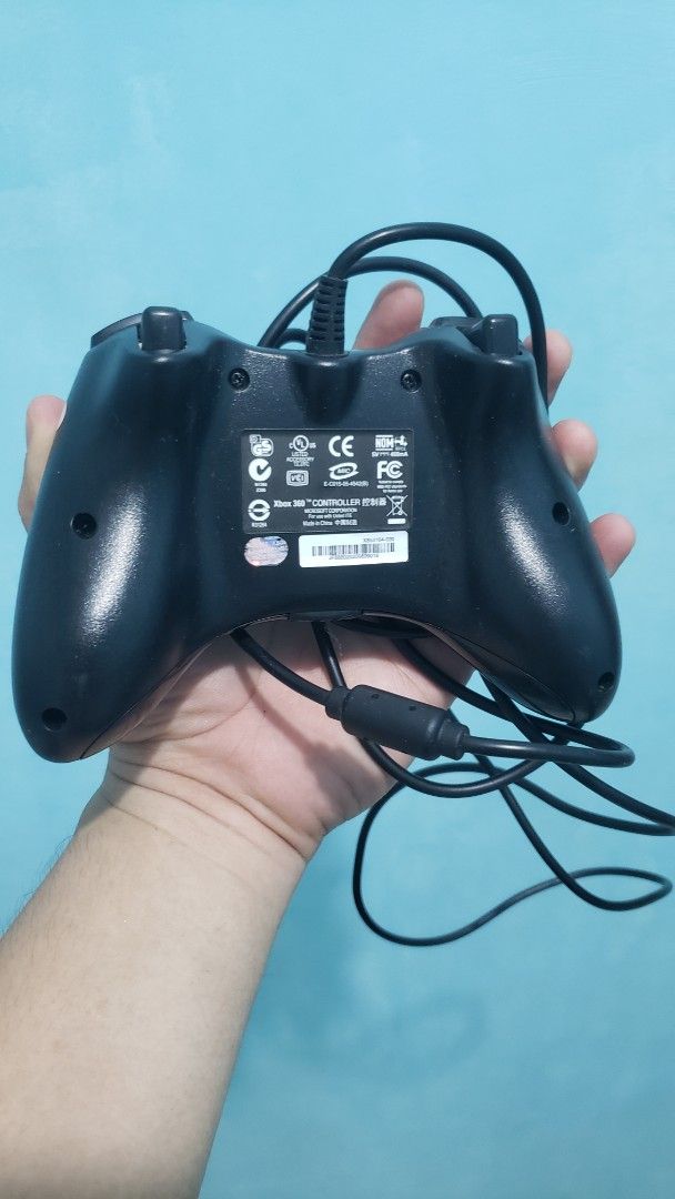 Wired Xbox 360 Controller (Category: Controllers) located in Daet. Submitted by leumas08 (Listing ID 1457010316, Image 3). Description: - Original wired controller for Xbox 360 - Classic black finish - Fully functional and works well - Shows minor scuffs from normal use - Ready for your next gaming session!.