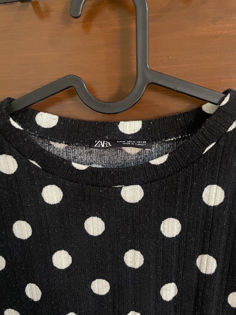 Zara Black White Polka Dot Short Sleeve Top (Category: Blouses) located in Caloocan City. Submitted by theresedolor (Listing ID 1457050549, Image 2). Description: - Classic black and white polka dot pattern - Short sleeves - Comfortable fit - Ribbed fabric texture - Raw hem detail on sleeves and bottom - Perfect for a casual, easy-to-style look.