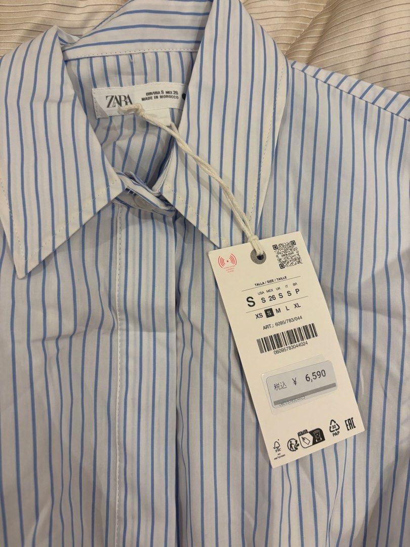 Zara Striped Sleeveless Shirt (Category: Shirts) located in Quezon City. Submitted by kindakristelle2481 (Listing ID 1457118752, Image 2). Description: - Zara sleeveless shirt - White and blue stripes - Button-up front with collar - Flared hem for a flattering fit - Size S - Brand new with original tags attached.