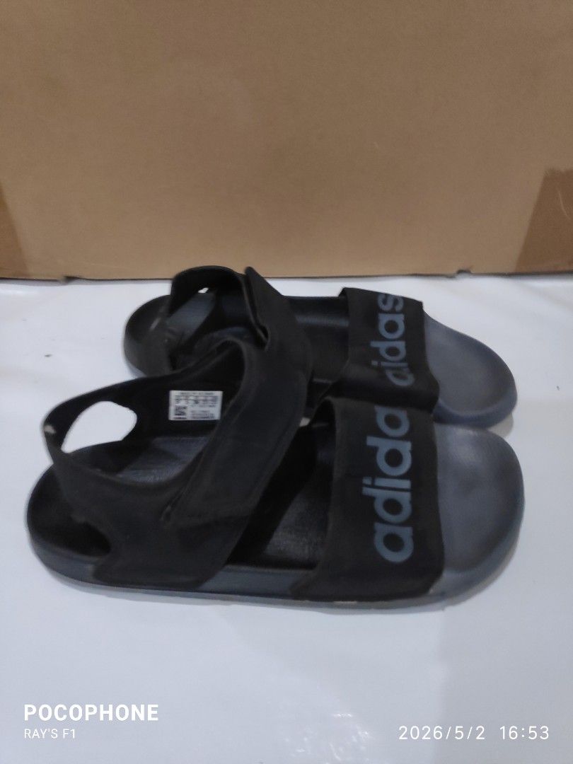Adidas Black Sandals (Category: Flats & Sandals) located in Pagsanjan. Submitted by rays-days (Listing ID 1457319388, Image 3). Description: - Black Adidas sandals - Adjustable velcro straps for a secure fit - Comfortable for everyday wear - Soles with excellent grip - Made in Vietnam - Size: 5 UK pm me meet up around SANTA CRUZ LAGUNA for shipping, buyer will shoulder the fees.