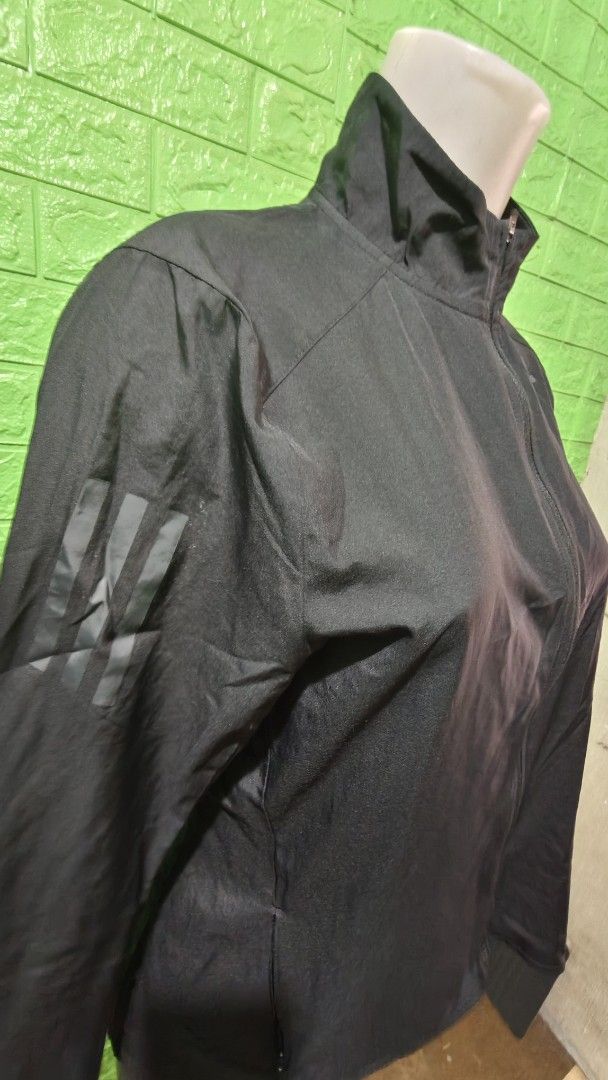 Adidas Black Track Jacket with 3-Stripes (Category: Coats, Jackets and Outerwear) located in Pasay City. Submitted by taytayswifty (Listing ID 1457219565, Image 2). Description: - Classic black Adidas track jacket - Iconic 3-stripes on sleeves - Full zip closure with stand-up collar - Lightweight material, perfect for workouts or casual wear - Adidas logo embroidered on the chest - Simple and timeless design.