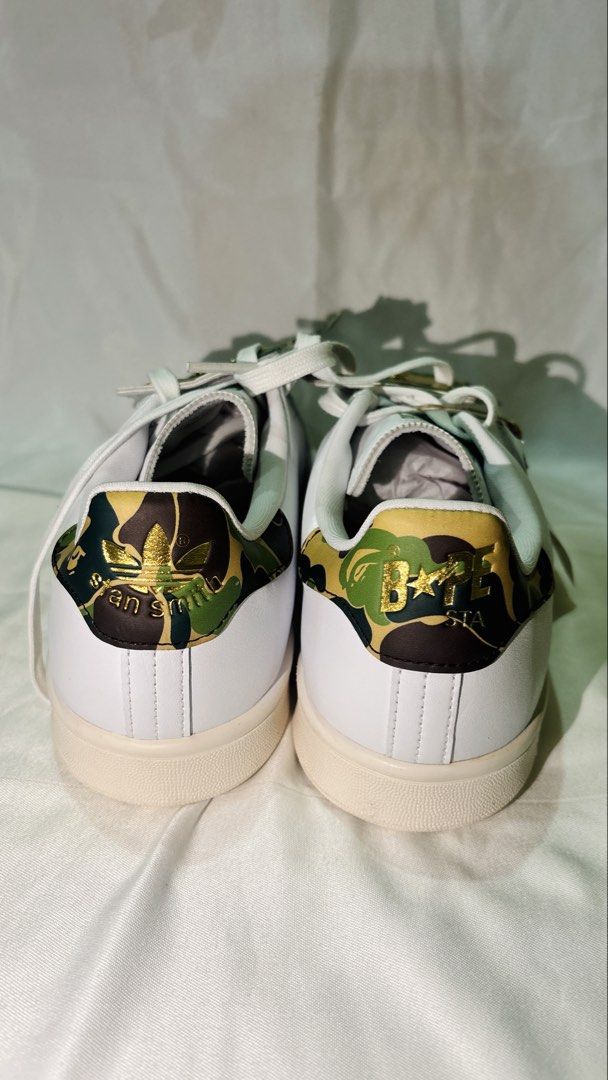 Adidas Stan Smith x BAPE Camo Sneakers (Category: Sneakers) located in Manila. Submitted by jade_67 (Listing ID 1457218967, Image 3). Description: - BAPE x Adidas Stan Smith Collaboration - Classic White Leather Upper - Iconic BAPE Camo Print on Tongue & Heel Tab - Green Accent Details - Original Tags Attached - Size: UK 8 / JPN 26.5 NO BOX!!!!.