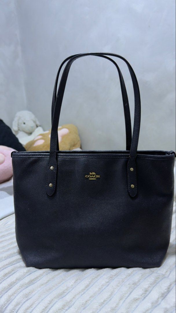 Auth Coach Mini City Zip Tote Bag (Category: Luxury Bags & Wallets) located in San Jose del Monte. Submitted by danggszz (Listing ID 1457324737, Image 1). Description: - Authentic preloved Coach Mini City Zip Tote Bag - Color: Dark Navy Blue (almost black) - Material: Leather - sticky -Dimensions Handles with 7” (17.75 cm) drop 9” L x 8” H x 4.25” W (22.75 x 20 x 10.75 cm) Please manage your expectations on this. May flaws and all napo.