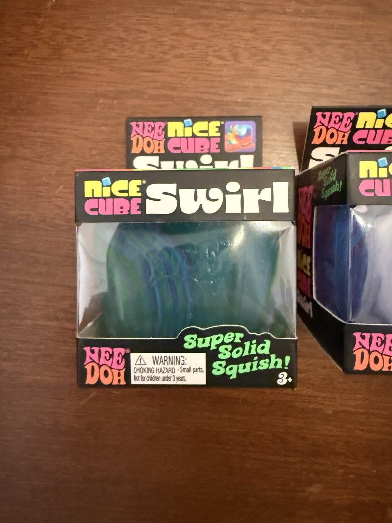 Authentic Nee Doh Nice Cube Swirl Super Solid Squish Toys (Category: Kids Toys) located in Manila. Submitted by decluttering_phil (Listing ID 1457143669, Image 2). Description: - Authentic NeeDoh Nice Cube Swirl squishy toys - Features a colorful swirl design - Great for sensory play and stress relief - Available in three fun colors: green swirl, blue/purple swirl, and orange (last pc)- 1,500 each - Suitable for both kids and adults.