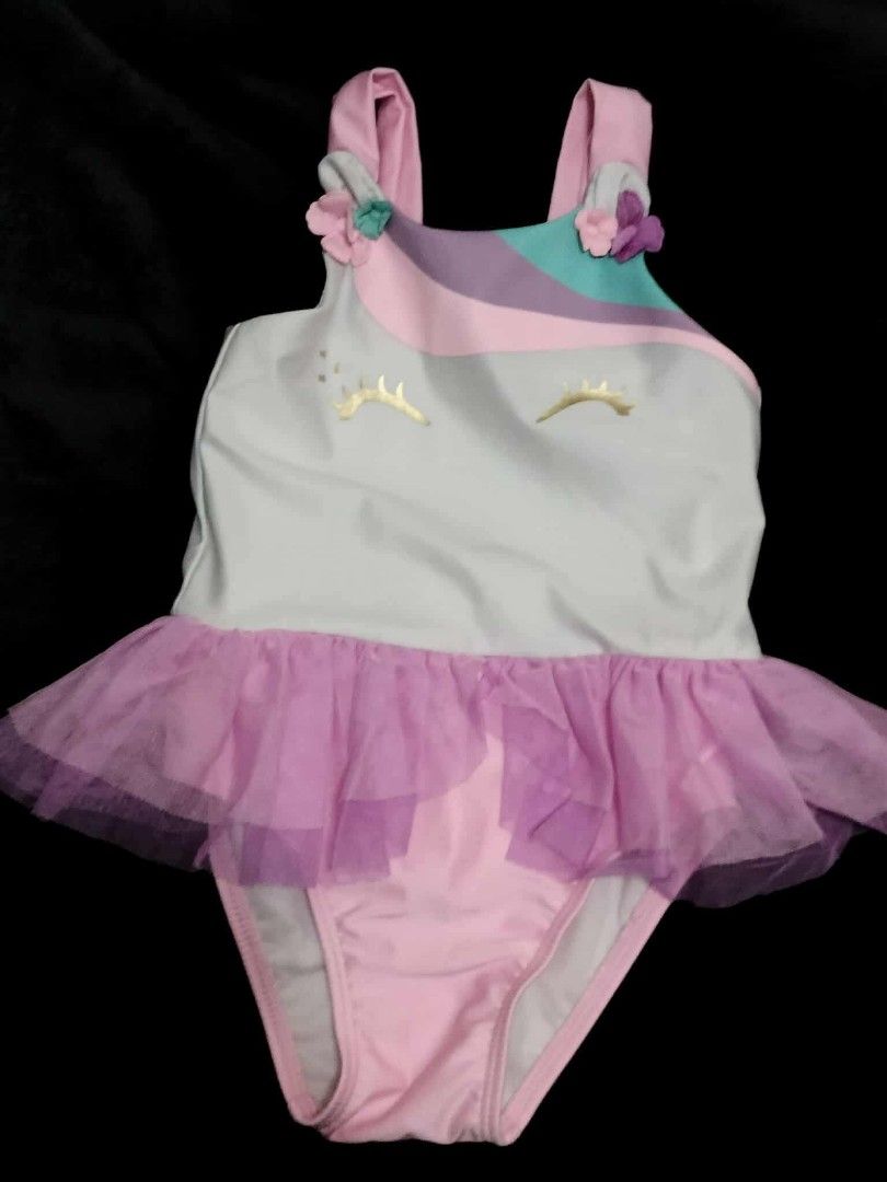 Baby Girl Clothes Bundle - Various Brands & Sizes (Category: Babies & Kids Fashion) located in Manila. Submitted by kalawgemil85037 (Listing ID 1457269463, Image 3). Description: Bundle of baby girl branded clothes. Includes a pink sparkly long-sleeve top, a red 'Star Spangled Cutie' bodysuit, a unicorn swimsuit with tutu, a striped H&M tank top, and a Calvin Klein butterfly bubble dress. Great mix for your little one..