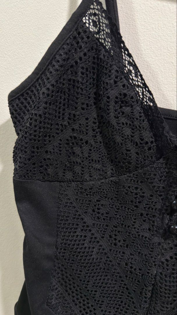 Black Lace Trim Bodysuit with Button Detail (Category: Others Tops) located in Cebu City. Submitted by ngl.prelovedstuff (Listing ID 1457156483, Image 3). Description: - Black bodysuit with delicate lace trim on bust and straps - Features a stylish button detail down the front - Adjustable straps for a perfect fit - Can be worn layered or as a standalone piece - Offers both comfort and a fashionable look.
