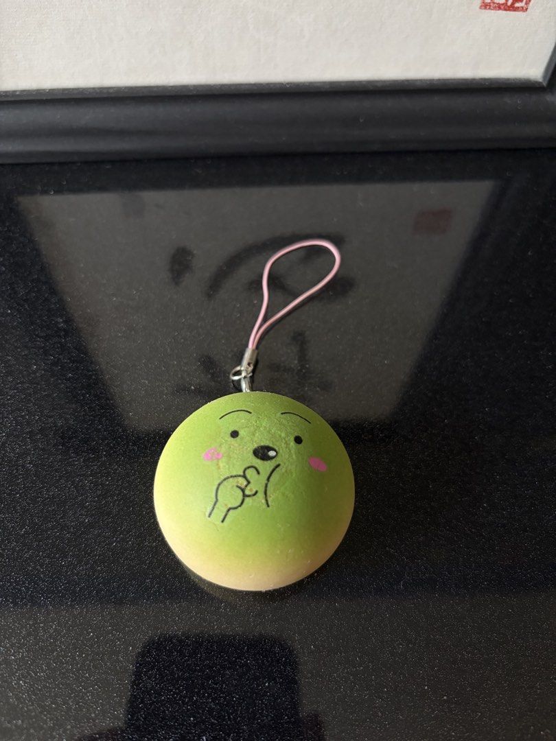 Bread Squishy (Category: Designer & Blind Box Toys) located in Singapore. Submitted by baebae04 (Listing ID 1457196553, Image 3). Description: - 2 squishy charms, 1 for $3, 2 for $5 - Medium rebound - Design 1: Bread roll with a big grin - Design 2: Green face with a shy expression - Both charms have attached straps - Ideal for decorating bags, backpacks, or keys - Can also be used as fun stress relievers.