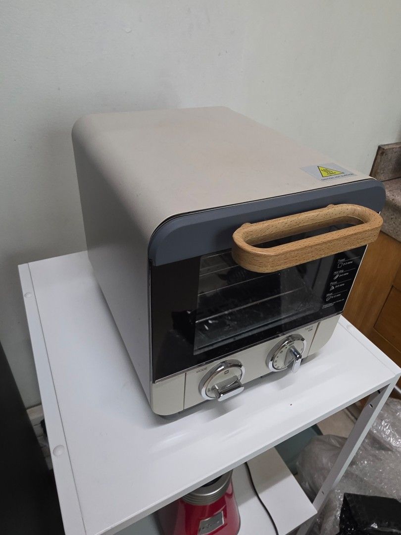 BRIKK Mini Oven with Timer and Mode Settings (Category: Ovens & Toasters) located in San Juan City. Submitted by mia.concep (Listing ID 1457255456, Image 3). Description: - Compact BRIKK mini oven - Timer and mode selection dials - Stylish wooden handle for easy opening - Interior rack included - Ideal for small kitchens or dorm rooms - Ready for a new home!.