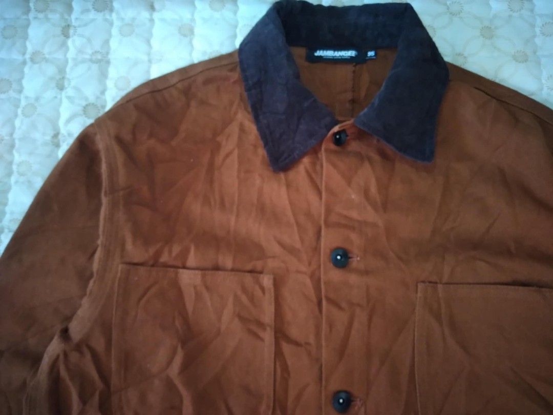 Brown Chore Jacket Cords Collar As New (Category: Coats, Jackets and Outerwear) located in Zamboanga. Submitted by nurbya898048 (Listing ID 1457207948, Image 2). Description: Brown workwear style jacket from Jambangee. Features a corduroy collar and button-up front. Two chest pockets and two lower pockets. Button cuffs. Great for layering. Original Denim Supply tag visible. It is typically made from heavy Canvass or duck cotton to handle wear and