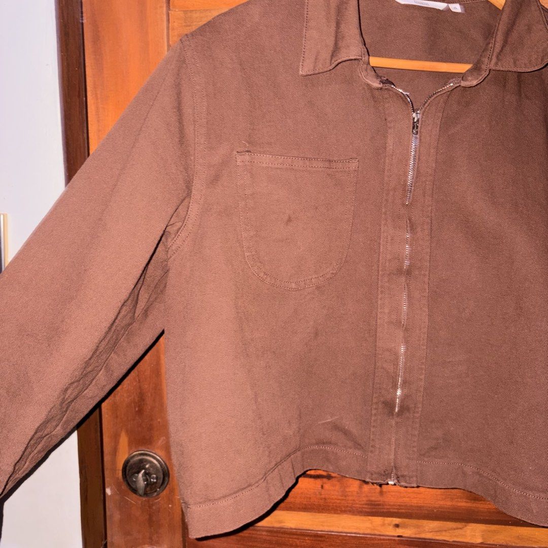Brown Jacket (Category: Coats, Jackets and Outerwear) located in Manila. Submitted by ciiii1 (Listing ID 1457309117, Image 3). Description: (Bought from Surplus SM) Size: XL Color: Brown Full-zip front closure with a classic collar Single chest pocket design Durable fabric with structured fit .
