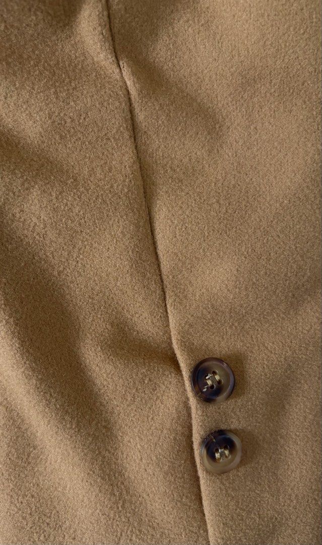 Brown winter coat (Category: Coats, Jackets and Outerwear) located in Manila. Submitted by lifestyle_declutter (Listing ID 1457170064, Image 3). Description: Price: Negotiable Orig price: Php 3k+ - Classic camel coat - Tie belt for adjustable fit - Lapel collar design - Quilted lining for warmth - Two functional front pockets - Button details on cuffs - Versatile for layering with jeans or dresses.