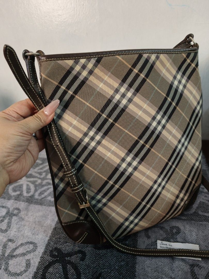 Burberry Blue Label Plaid Shoulder Bag (Category: Luxury Bags & Wallets) located in Antipolo. Submitted by prelovedbyfhaye (Listing ID 1457266066, Image 1). Description: - Authentic Burberry Blue Label crossbody bag - Classic plaid pattern with leather trim - Adjustable strap with buckle detail - Interior zip pocket and slip pocket - Clean interior - Great everyday bag.