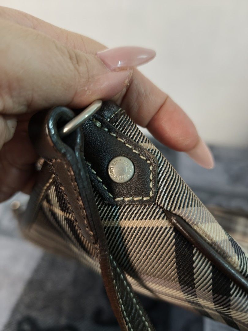 Burberry Blue Label Plaid Shoulder Bag (Category: Luxury Bags & Wallets) located in Antipolo. Submitted by prelovedbyfhaye (Listing ID 1457266066, Image 3). Description: - Authentic Burberry Blue Label crossbody bag - Classic plaid pattern with leather trim - Adjustable strap with buckle detail - Interior zip pocket and slip pocket - Clean interior - Great everyday bag.