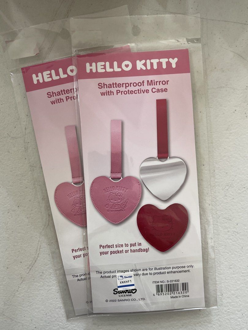 Buy one Take one Hello Kitty Shatterproof Mirror with Protective Case Keychain (Category: Mirrors) located in Manila. Submitted by phoebe1.23.7 (Listing ID 1457207246, Image 2). Description: - Adorable pink heart-shaped Kitty mirrors - Shatterproof for safety - Includes a protective case - Features a convenient strap for attaching to bags - Ideal for quick makeup touch-ups anywhere.