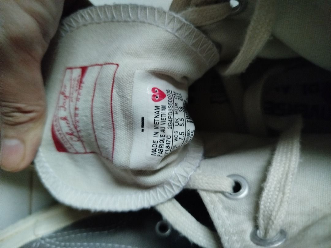 CDG x Converse Chuck Taylor All Star High Grey (Category: Dress Shoes) located in Cebu City. Submitted by kathleenpatac7 (Listing ID 1457216575, Image 3). Description: - Grey Comme des Garçons PLAY x Converse Chuck Taylor All Star high-top sneakers - Features the iconic heart logo on the side - Classic canvas upper with rubber sole - Laces are intact - Size: 7.5 US Women's.