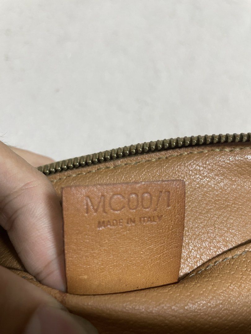 Celine Monogram Pouch Bag (Category: Luxury Bags & Wallets) located in Pili. Submitted by samskolekta_12. (Listing ID 1457316888, Image 3). Description: - Authentic Celine Monogram Pouch - Classic brown and tan colorway - Genuine leather trim and zipper - Interior features two slip pockets - Made in Italy - Approximate Measurements: 9" (L) x 5" (H) x 3" (D).