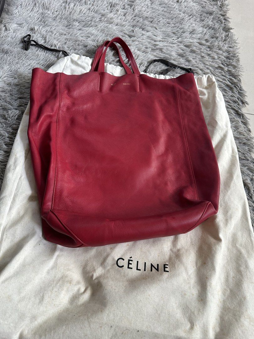 Celine Red Leather Tote Bag (Category: Luxury Bags & Wallets) located in Manila. Submitted by marmarpec (Listing ID 1457162564, Image 1). Description: - Authentic Celine tote bag - Vibrant red color - Made in Italy - Soft and supple leather - Spacious design, perfect for everyday use - Comes with original Celine dust bag - Perfect work bag or day out bag - flaw- small pen mark ( pls ref to pic).