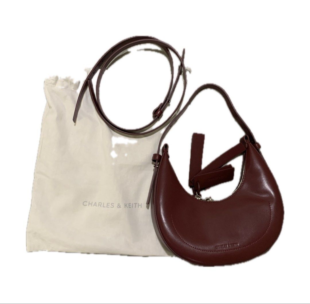 CHARLES & KEITH Carey Crescent Hobo Bag (Category: Shoulder Bags) located in Calamba. Submitted by belineise (Listing ID 1457209704, Image 1). Description: orig price: 3,399 php - never been used.