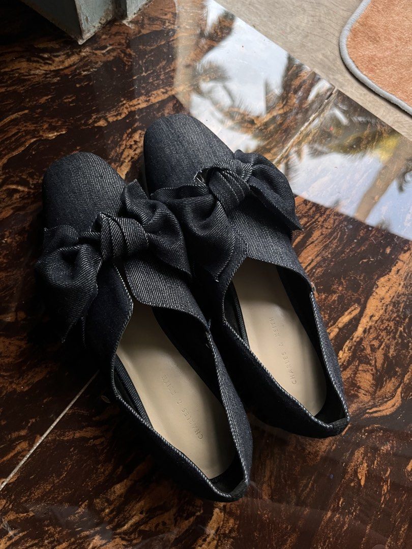 Charles & Keith Dark Blue Denim Flats Size 39 (Category: Flats & Sandals) located in Masbate. Submitted by leylauren_16 (Listing ID 1457233731, Image 2). Description: - Charles & Keith dark blue denim flats - Size 39 - Textured sole for enhanced grip - Denim material with a subtle shimmer - Easy slip-on style - Ideal for casual outfits.