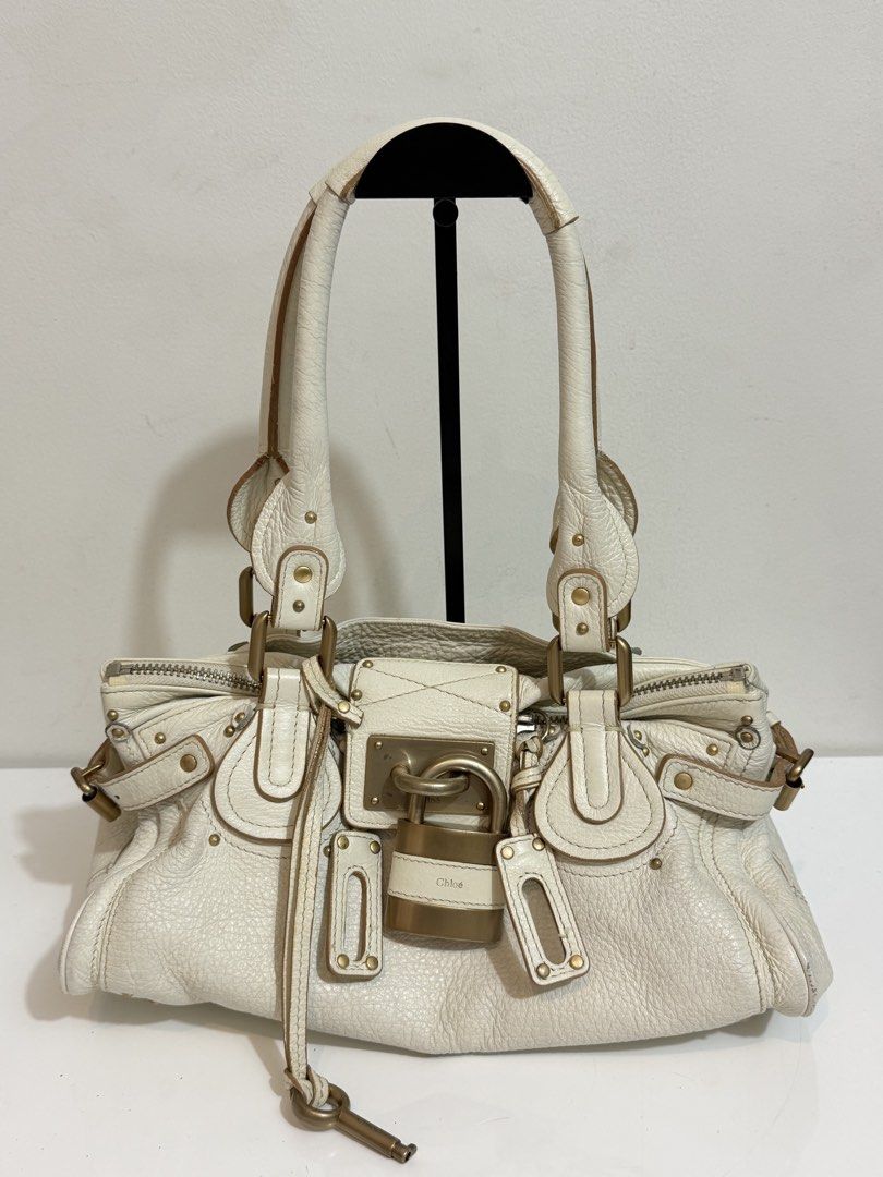 SOLD- Chloe Paddington (Category: Luxury Bags & Wallets) located in Quezon City. Submitted by loveangelmusicbaby (Listing ID 1457313003, Image 1). Description: - Off white soft pebbled leather -missing tag/code inside hence selling low -has minor signs of usage but still in very good condition -N.G.A. -please inspect all photos before buying. No to low ballers! .