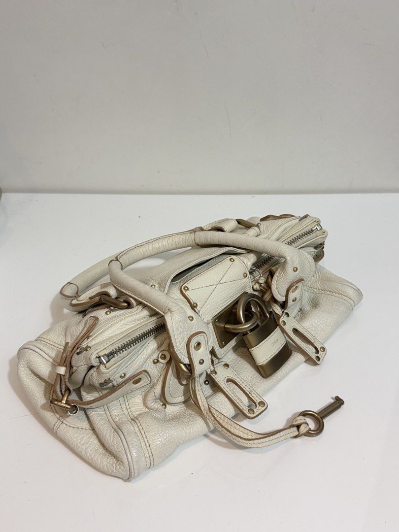 SOLD- Chloe Paddington (Category: Luxury Bags & Wallets) located in Quezon City. Submitted by loveangelmusicbaby (Listing ID 1457313003, Image 2). Description: - Off white soft pebbled leather -missing tag/code inside hence selling low -has minor signs of usage but still in very good condition -N.G.A. -please inspect all photos before buying. No to low ballers! .