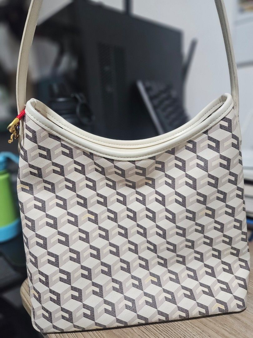 Christy Ng Alesso Tote Bag (Category: Tote Bags) located in Pasay City. Submitted by chichaarown (Listing ID 1457282991, Image 1). Description: - Geometric pattern tote bag by Christy Ng - Cream interior with pockets - Magnetic snap closure - Minor pink marks on interior flap -Dust and tote bags still available -NO TO LOWBALLING.