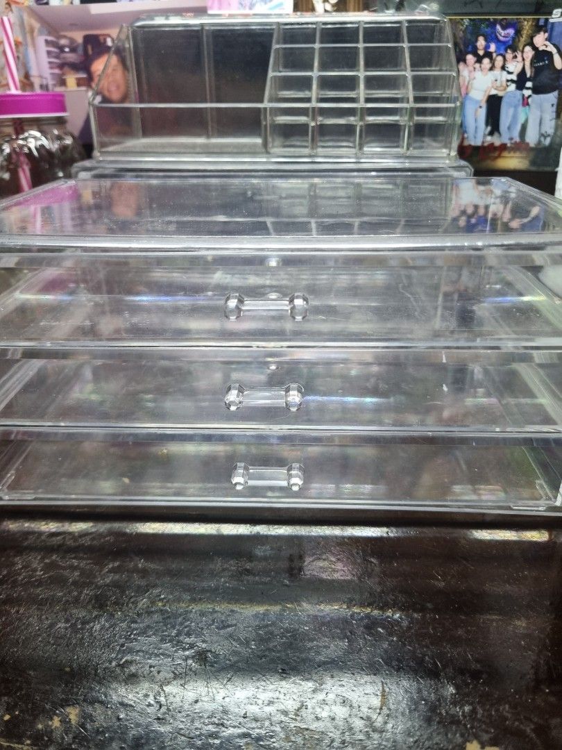 Clear Acrylic Makeup Organizer with Compartments (Category: Makeup) located in Manila. Submitted by museoftheartist (Listing ID 1457277576, Image 3). Description: - Clear acrylic organizer for makeup and cosmetics. - Multiple compartments for lipsticks, brushes, and more. - Top section features smaller slots. - Larger compartment in the bottom section. - Perfect for a tidy vanity. - Easy to clean..