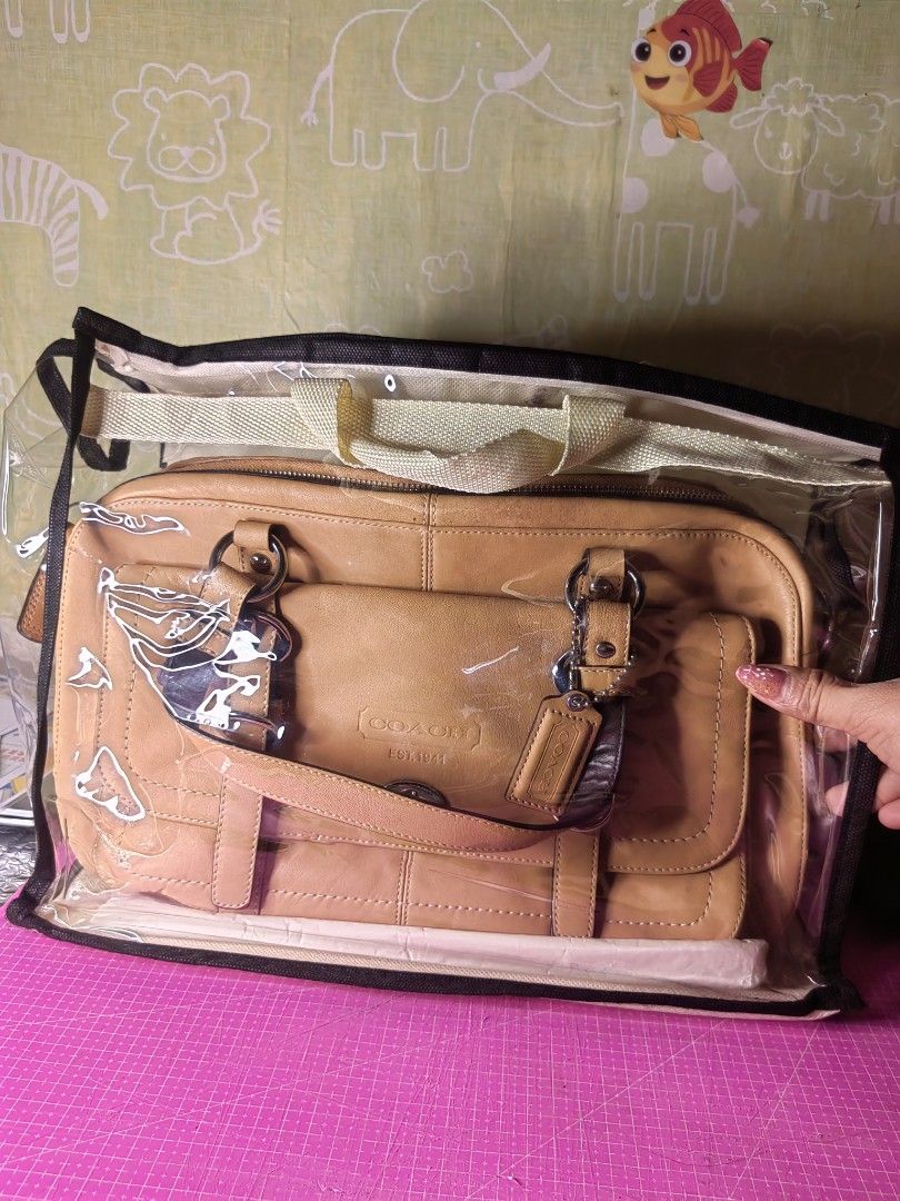 Coach Leather Handbag Est. 1941 Tan (Category: Luxury Bags & Wallets) located in Manila. Submitted by dryt1 (Listing ID 1457178016, Image 1). Description: - Genuine tan leather Coach handbag - Front flap pocket with secure turn-lock closure - Top zipper closure for added security - Elegant silver hardware details - Includes original Coach hangtag - Ideal everyday bag for style and practicality.