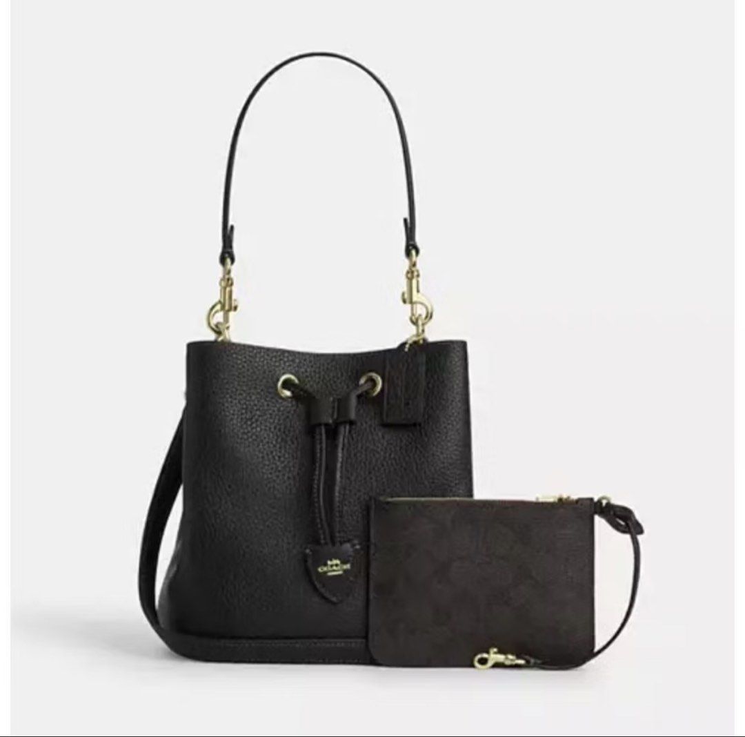 Coach Rowan bucket bag (Category: Luxury Bags & Wallets) located in Las Pinas. Submitted by makiyan_ (Listing ID 1457260299, Image 1). Description: - Authentic Coach black pebbled leather bucket bag - Gold hardware - Comes with a matching monogrammed pouch - Adjustable strap.