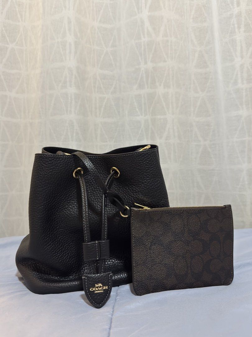 Coach Rowan bucket bag (Category: Luxury Bags & Wallets) located in Las Pinas. Submitted by makiyan_ (Listing ID 1457260299, Image 2). Description: - Authentic Coach black pebbled leather bucket bag - Gold hardware - Comes with a matching monogrammed pouch - Adjustable strap.