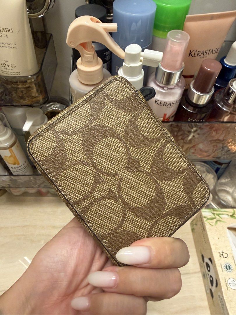 Coach Pill Organizer (Category: Luxury Bags & Wallets) located in Manila. Submitted by troddetrading (Listing ID 1457148888, Image 2). Description: - Authentic Coach monogram pill pouch - Features a convenient weekly pill organizer with daily compartments - Secure zipper closure - Ideal for travel and daily organization - Compact and portable design.