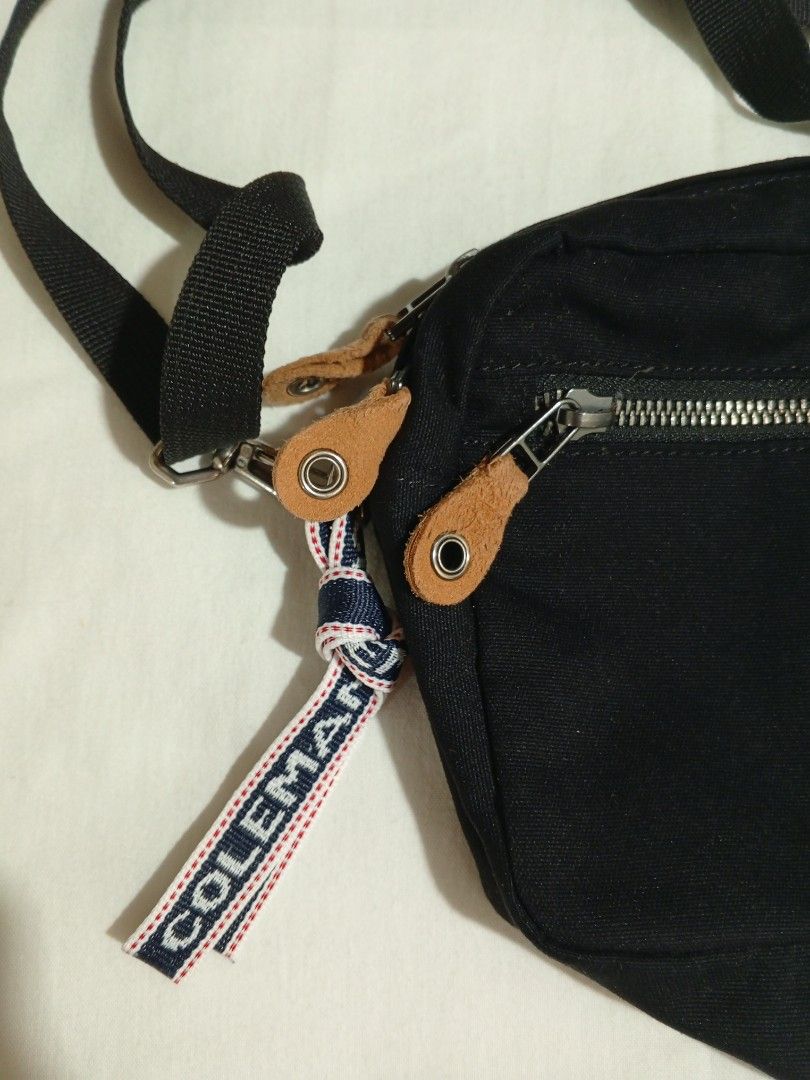 Coleman Black Canvas Crossbody Bag (Category: Accessory Holder, Box & Organizers) located in Castillejos. Submitted by eross07 (Listing ID 1457250266, Image 3). Description: - Brand: Coleman - Color: Black - Material: Canvas - Style: Crossbody bag - Features: Zippered front pocket, main compartment, leather accents, adjustable strap, Coleman tag detail - Origin: Made in Vietnam - Ideal for: Everyday use, travel.