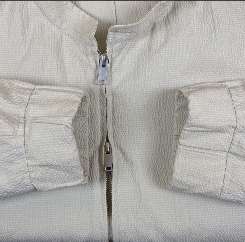 Cos Seersucker Blouson Cropped Double Zip Jacket (Category: Coats, Jackets and Outerwear) located in Bacolod City. Submitted by treasurehunts.6100 (Listing ID 1457268708, Image 3). Description: Cos Seersucker Blouson Cropped Double Zip Jacket Condition - New Color - Cream Color rate - 9.8 / 10 Material - 72% Cotton , 27% Polyester , 1% Elastine Made in Turkey Flaws - Dot Dirt ( Barely Noticeable ) Size XL Dimensions : Width - 24 Length - 27 Shoul