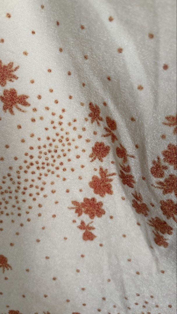 Cream Floral Print Mini Skirt (Category: Skirts) located in Los Banos. Submitted by ddn_07 (Listing ID 1457246466, Image 2). Description: - Cute cream mini skirt - Subtle orange floral print - Lettuce hem edge - Lightweight material, ideal for warm weather - Easy to style with a simple top - Perfect for casual outings or nights with friends.