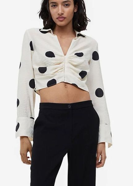 Cream Polka Dot Ruched Cropped Shirt (Category: Shirts) located in Cebu City. Submitted by mickaaay (Listing ID 1457261509, Image 1). Description: - Cream long-sleeved shirt - Black polka dot pattern - Ruched front detail - Button closure - Cropped length - Textured fabric finish - Versatile for casual or dressed-up outfits.